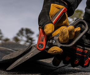 Man using CW11TM Tradesman Shears to cut shingles