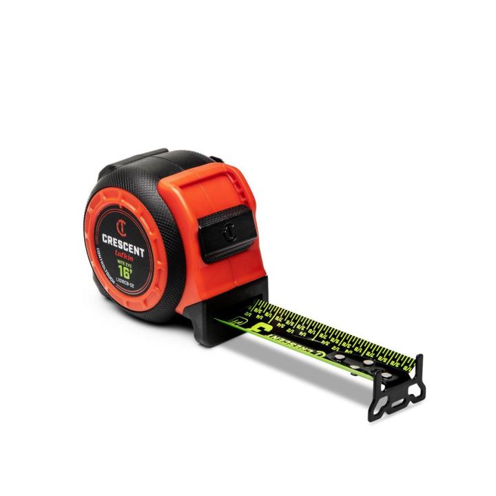 Crescent  L1016CB-02  1-3/16 x 16' CONTROLTOUCH NITE EYE Tape Measure  sitting on an angle with the blade end hook and blade lock facing the lower right corner with the blade extended 3 inches on a white background